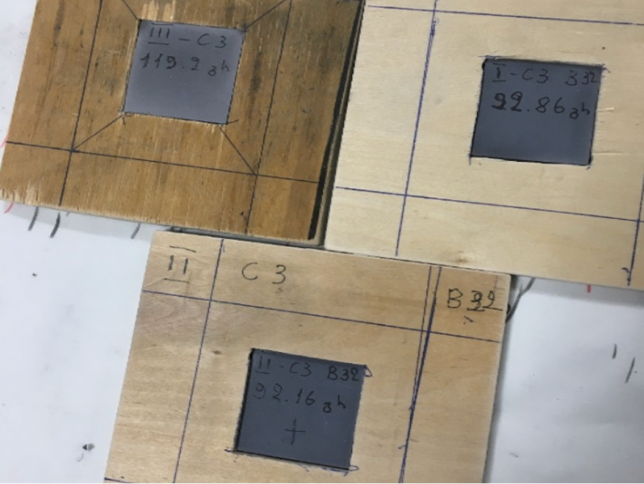 Sintered plates mounted in labelled plywood test frames