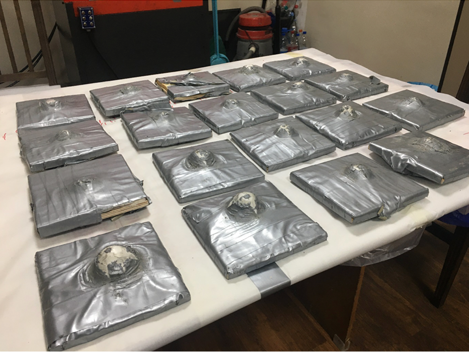 Collection of ballistic tested armor panels after live fire trials