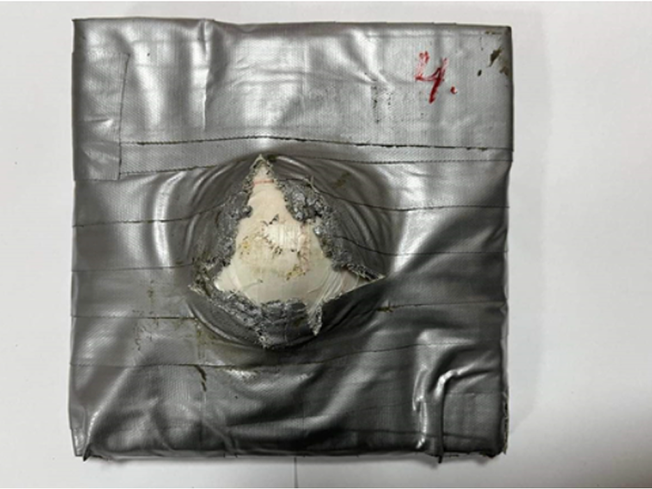 Close-up of a stopped projectile deformation in the armor panel