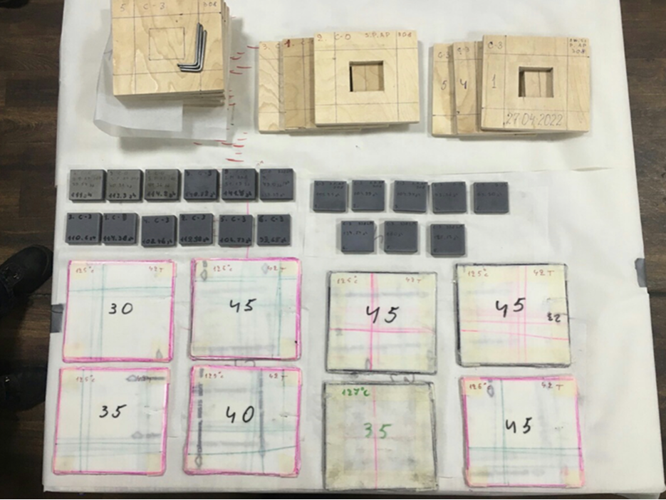 Batch of sintered armor plates with measurement records and backing frames