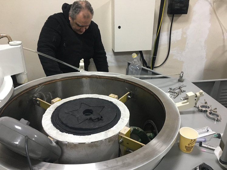 Loading cold pressed plates into the vacuum furnace chamber